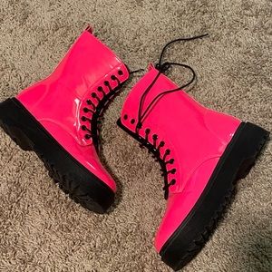 Neon pink combat boots